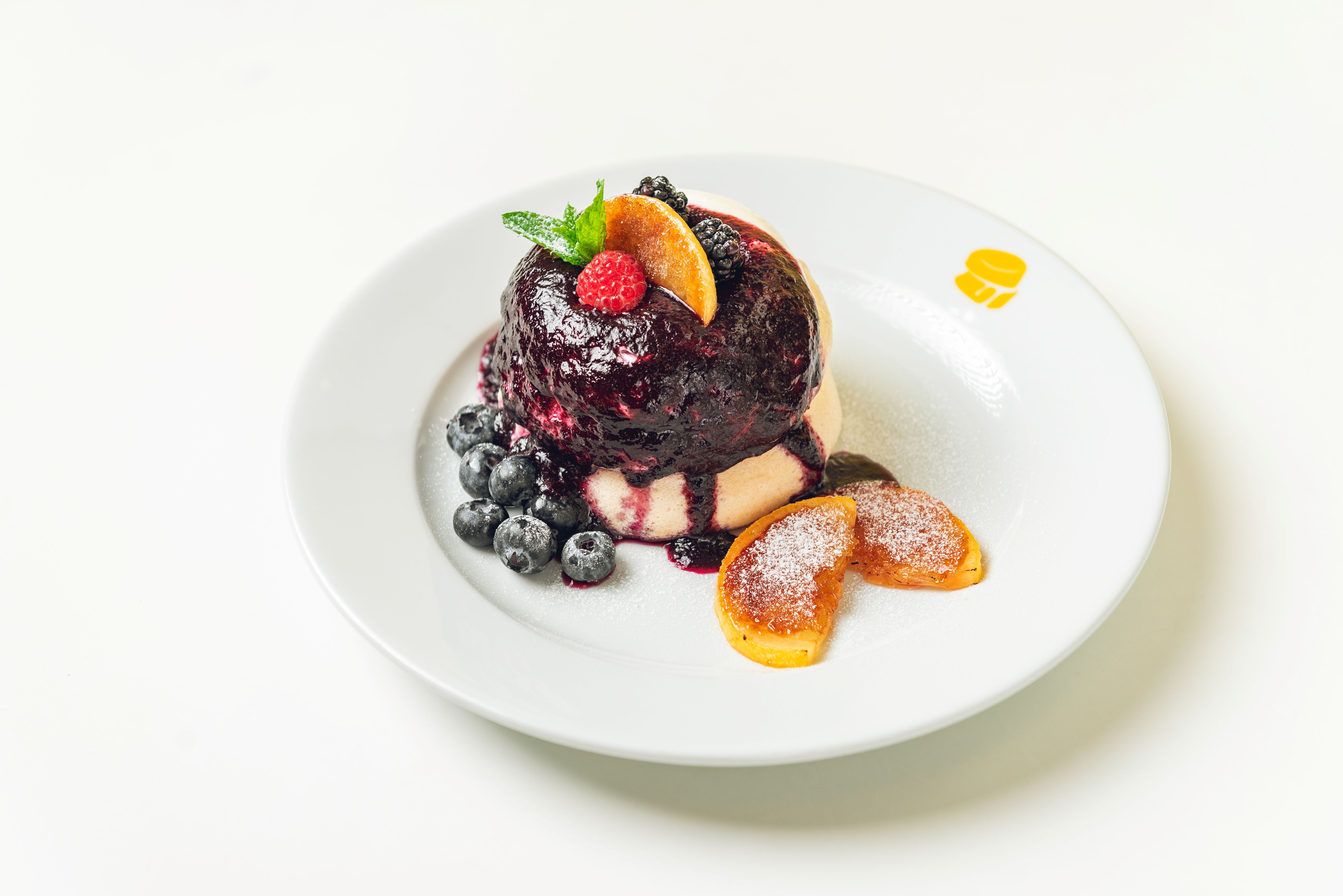 Fuwa Fuwa blueberry soufflé pancake served on a white plate.